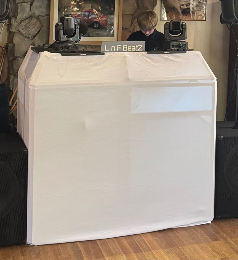 DJ Booth with White and Black Scrims and Metal Corner Shelves