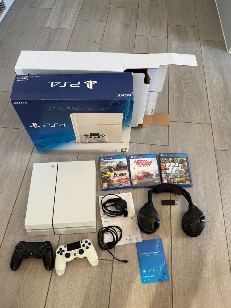 playstation 4 with box 2 controllers