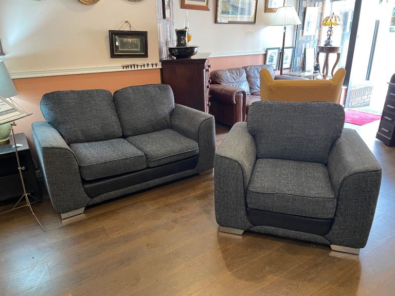 Sofa & Armchair in dark grey fabric and black trim, very clean and very comfortable 