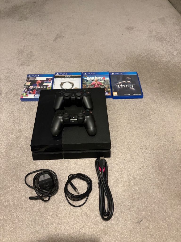 PS4 Console with 2 Controllers and 4 Games
