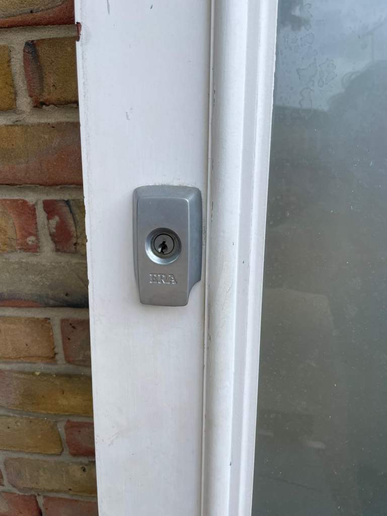 Double glazed front solid door white with locks, handle and hinges.