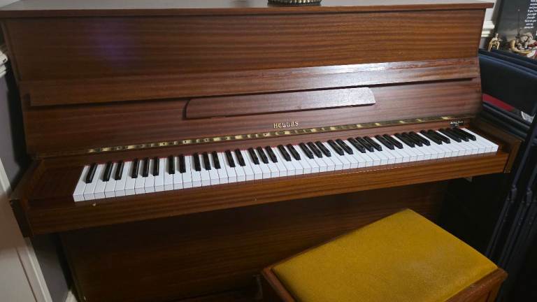 Hellas upright piano with stool. 