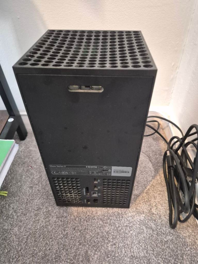 Xbox Series X w/ all leads and controller.