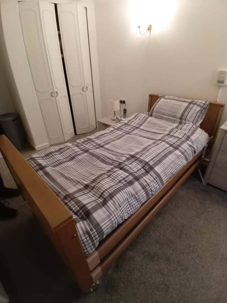 Electric care bed with cot sides