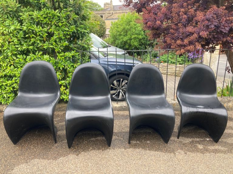 Set of 4 black plastic reproduction Vitra Panton chairs 