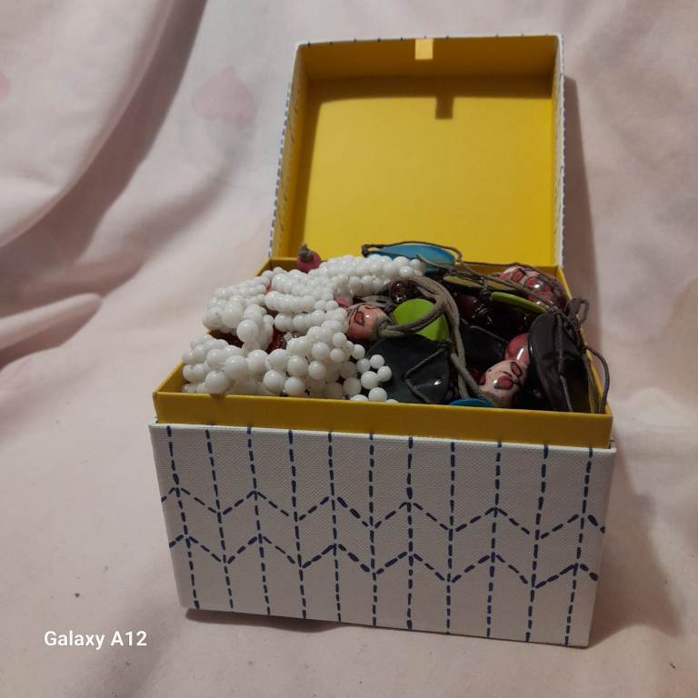 White box full of costume jewellery 