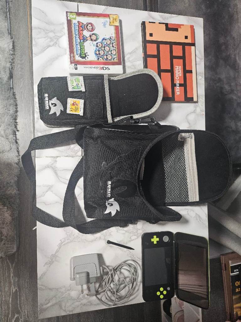 image for Nintendo New 2DS XL – Black & Green – Mario Games Bundle – £185