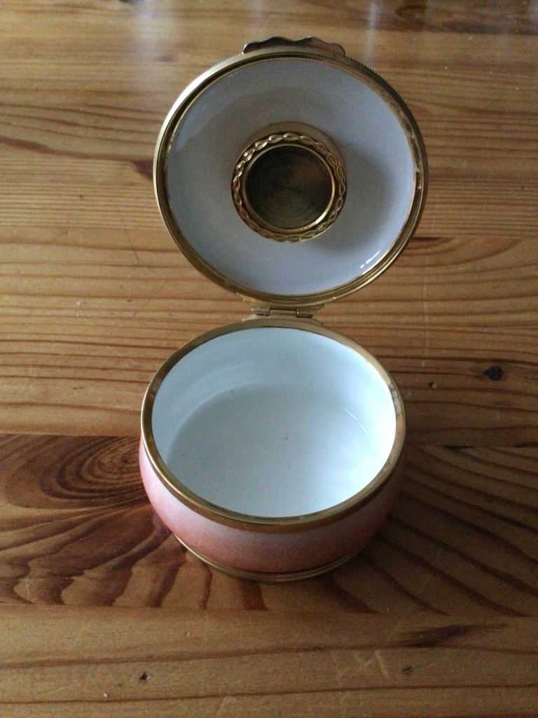 Halcyon Days salmon pink enamel trinket box with inset clock to lid.