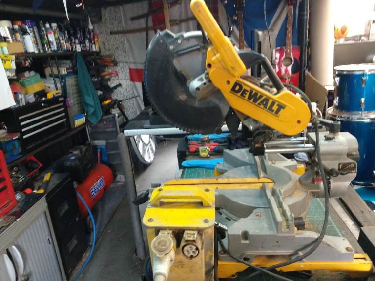DEWALT DW718 110 VOLT WITH 240 VOLT TRANSFORMER  12 INCH SLIDER  MITRE SAW