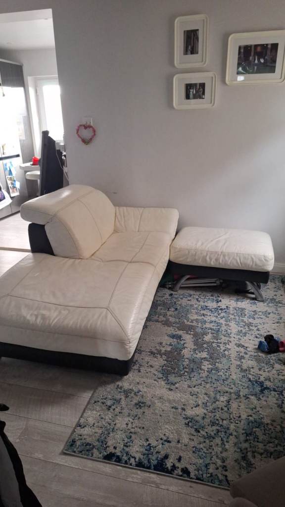 White and black leather chaise sofa and footstool and footstool