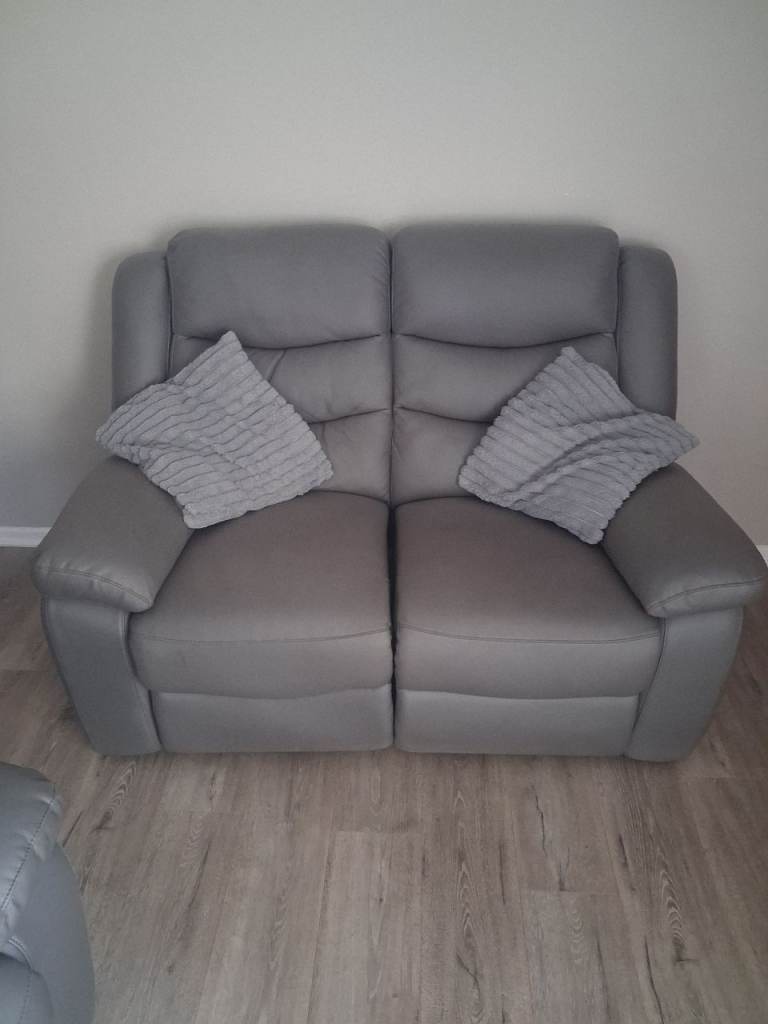 Two seater recliner as new.