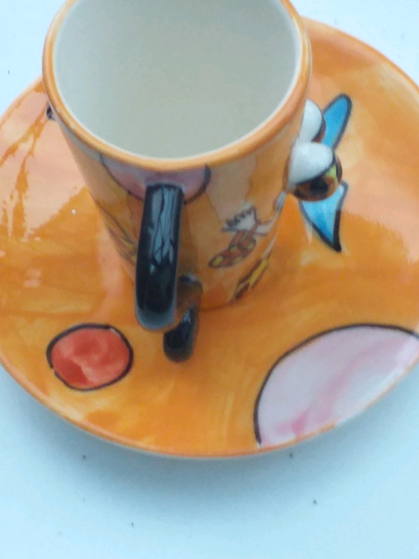 2 novelty coffee cups and saucers 