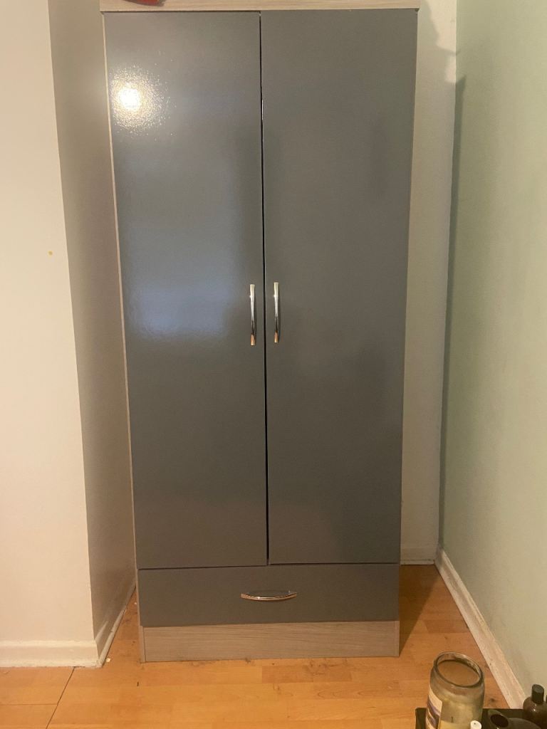 Grey glossy cupboard and chest of drawers set