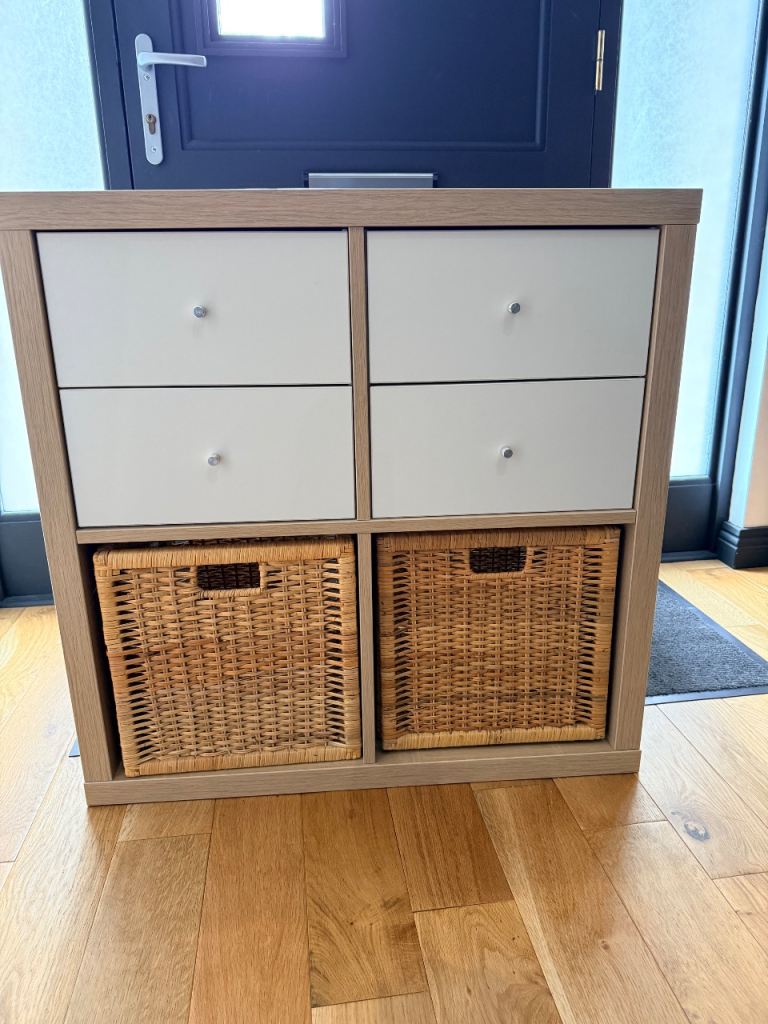 Kallax shelving unit with drawers and rattan baskets