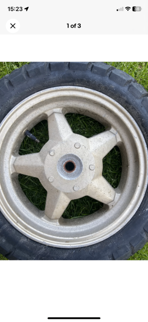 130 80 12 69J  J12xMT3.50 1999 Suzuki UC125 Rear Rim. Tyre punctured