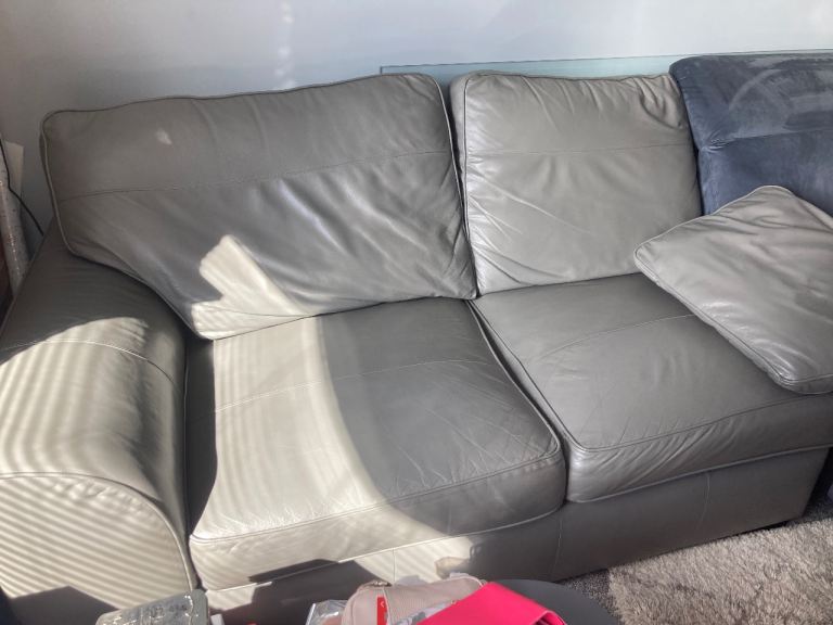 Two-Seater Grey Leather Sofa – Good Condition