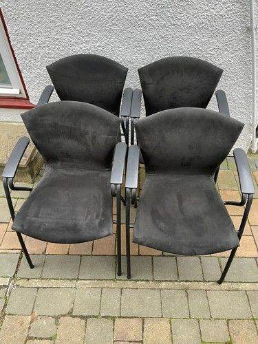 Set of 4 comfortable, padded black chairs