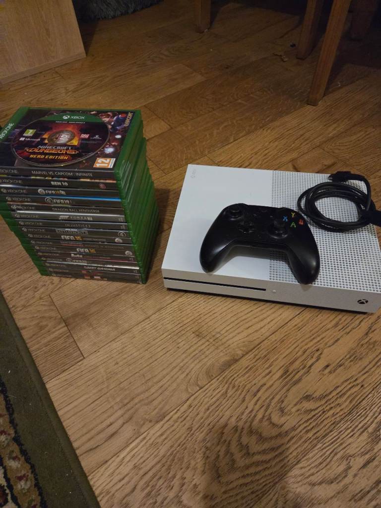 Xbox one s and assortment of games