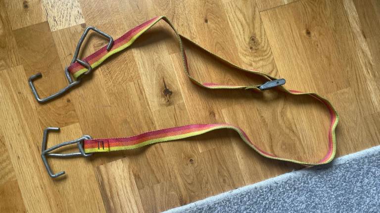 Two roof rack tie down straps