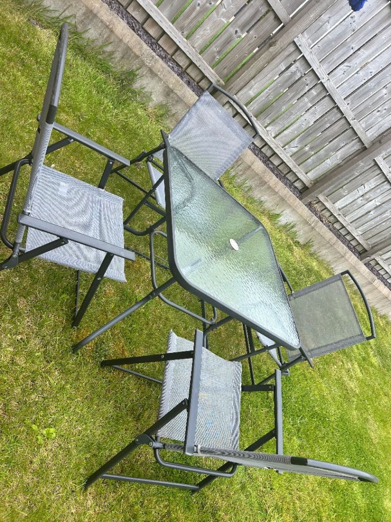 Set of 4 chairs and glass top table - garden furniture