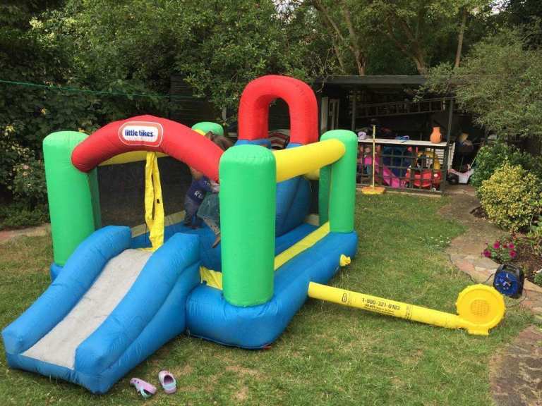 Little tykes jump and double slide bouncy castle .