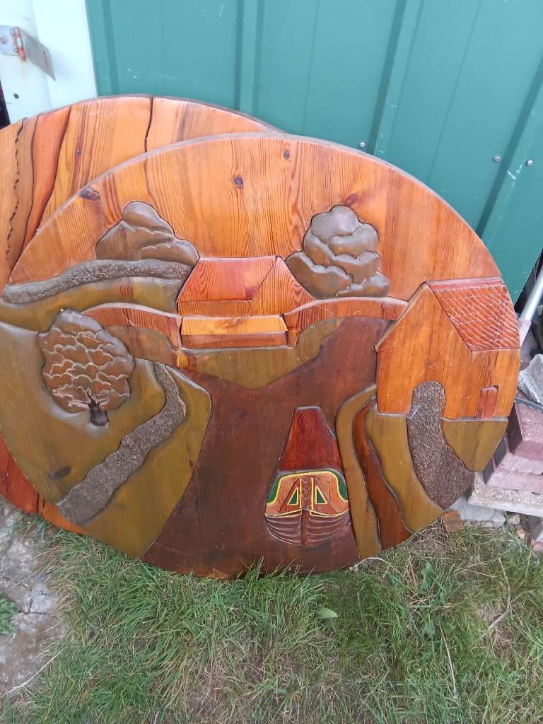 Giant wooden puzzle of a house and canal boat scene 