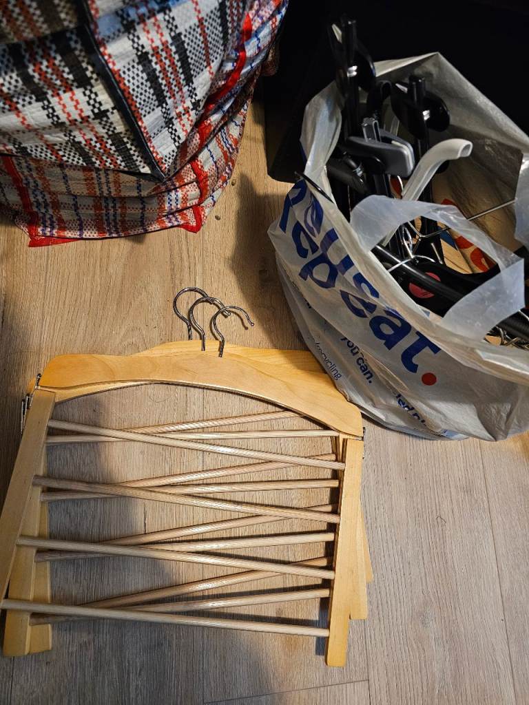 Wooden, plastic and metal coat hangers. Free. Collection S6