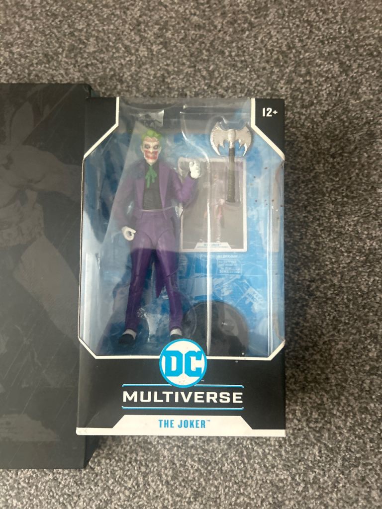 Dc multiverse joker figure/ hush Batman book and dvds