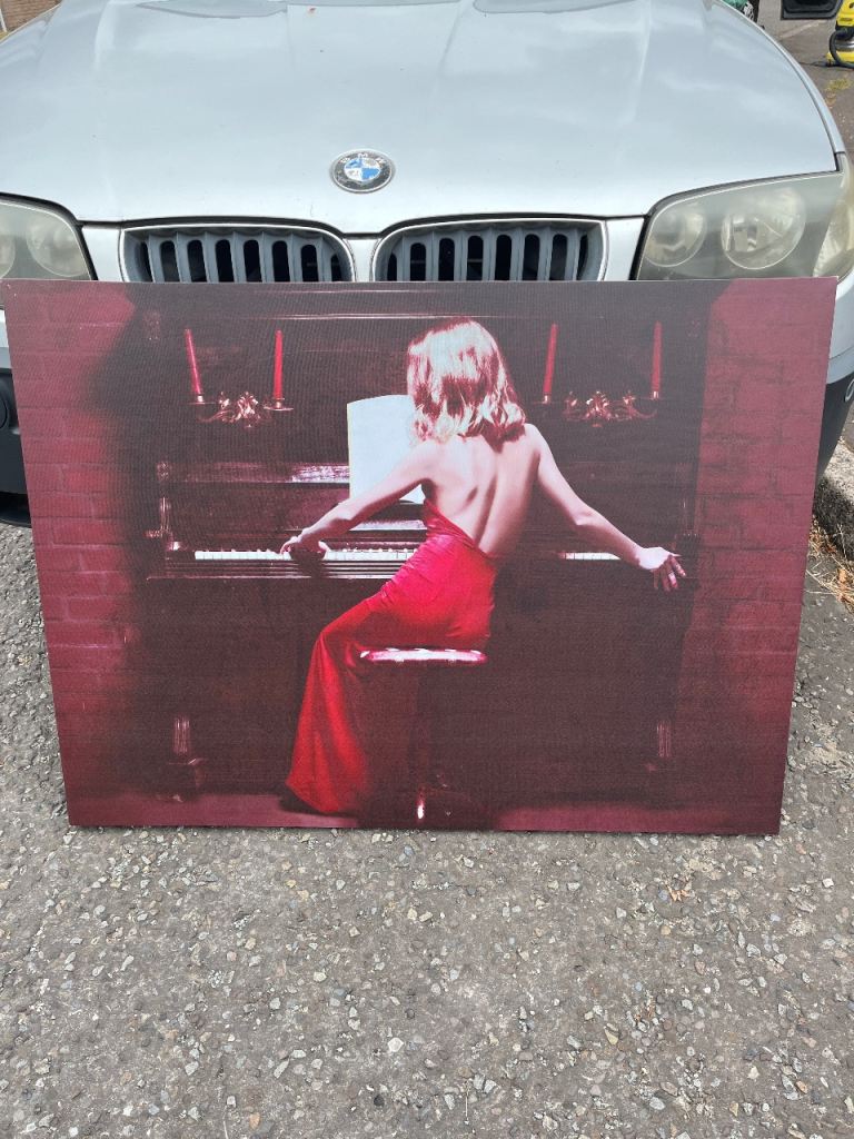 Free Striking Canvas Painting of Woman at Piano – Good Condition