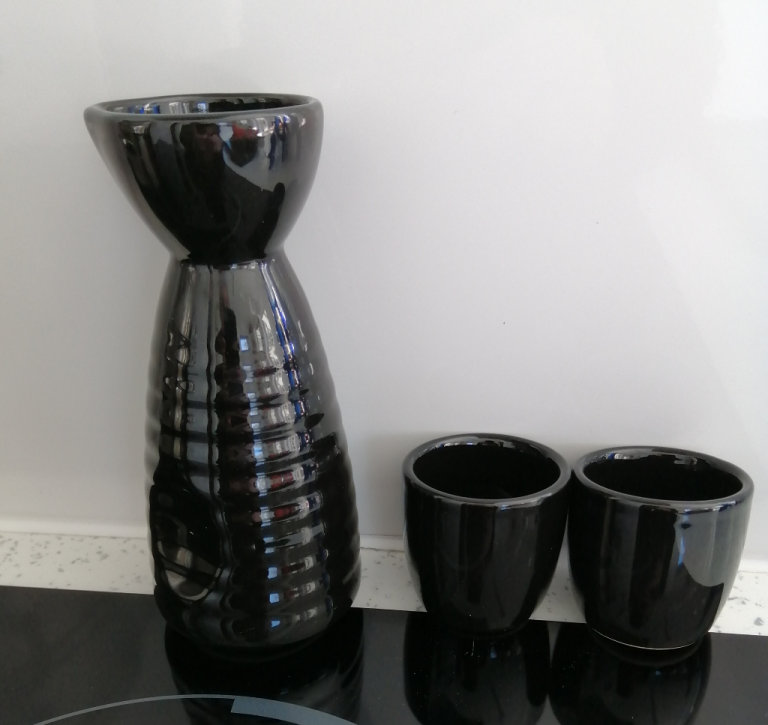 A Small Black M&S Flagon and 2 Shot Cups. 