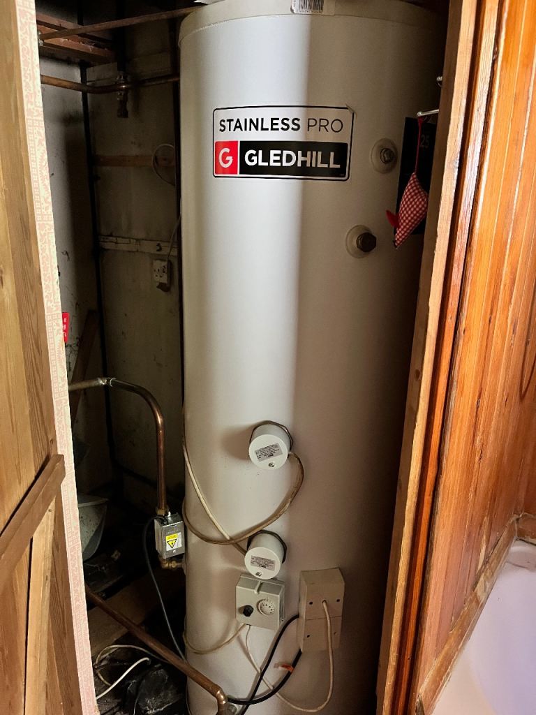  2 x 1200 litres Titan oil storage tanks. Gledhill hot water cylinder