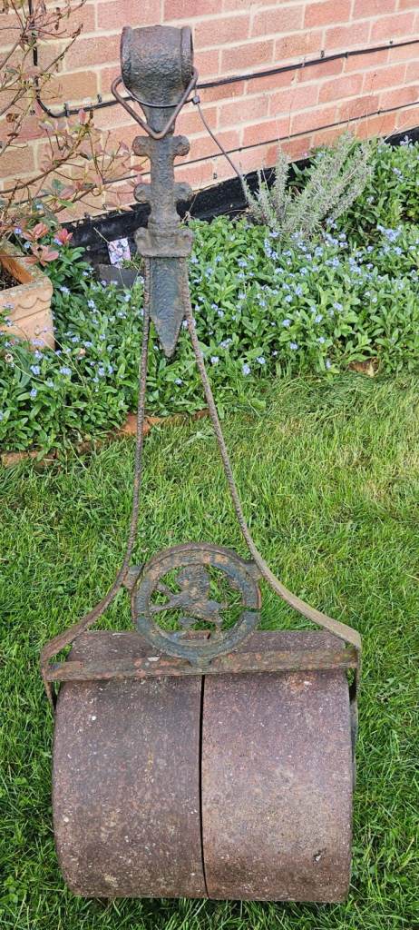 Vintage cast iron garden roller for use or decorative garden iem 