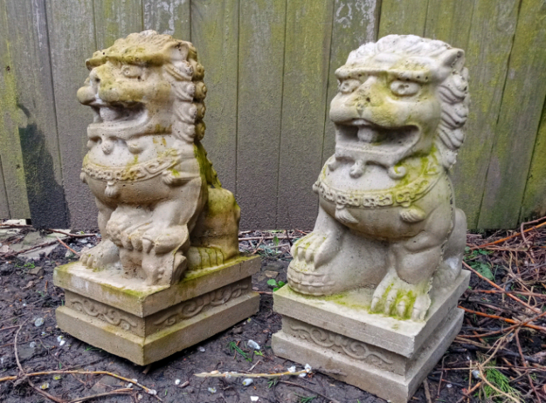 Pair of old stone garden lions