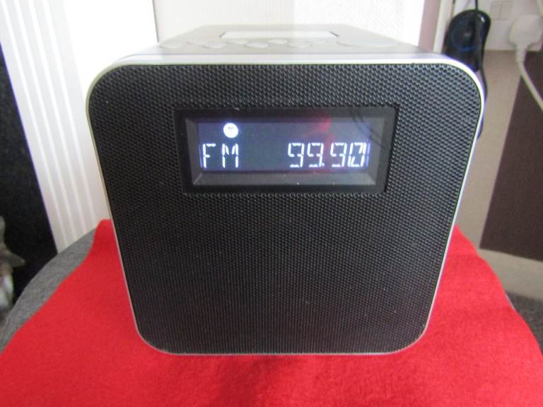 A POLAROID MAINS RADIO DOCKING SYSTEM. WORKS GREAT!