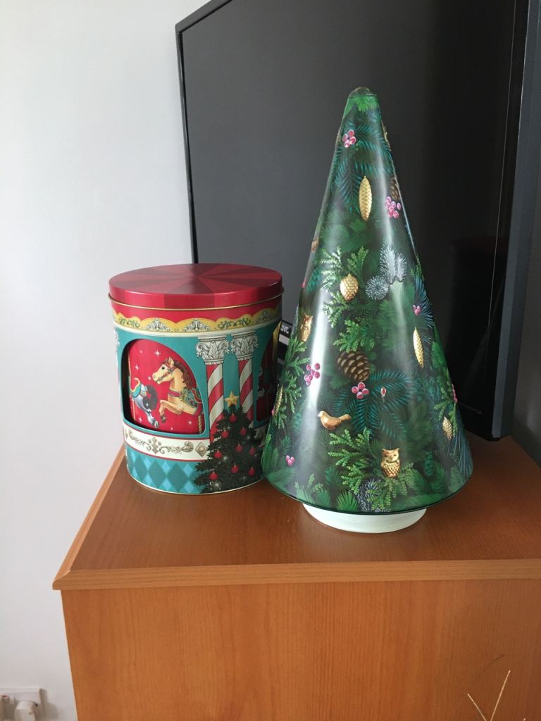  2 empty musical Christmas  tins.