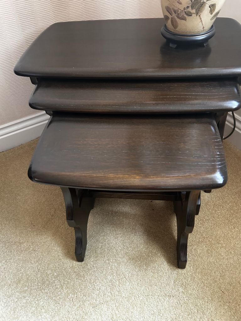 Nest of 3 vintage Ercol stacking side tables. Dark wood. 