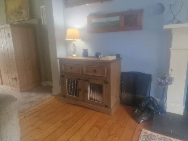 Sideboard with dog bed.