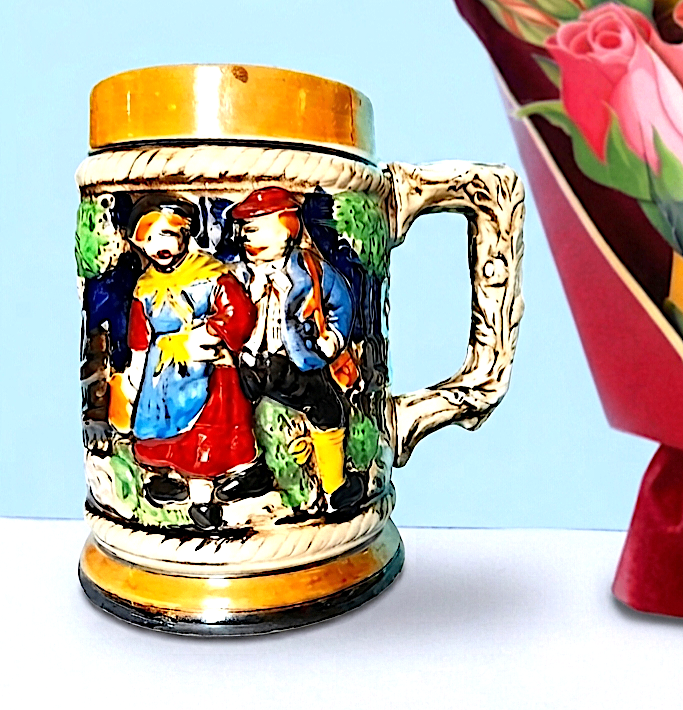 CERAMIC STEIN - MAN. LADY and SKI LODGE - multi-coloured 13 cm GOOD