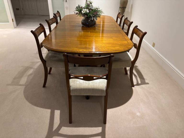 Large genuine Ian Dickinson dining table with 8 chairs. Walnut veneer finish. 