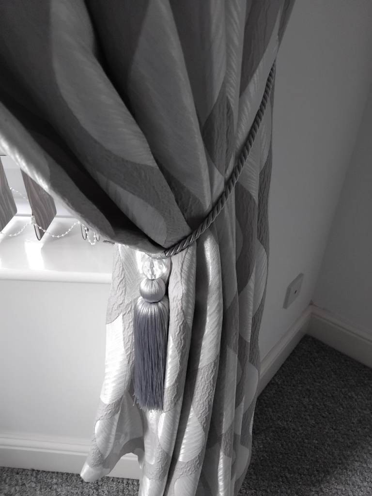 Pair of Eyelet Curtains with tiebacks