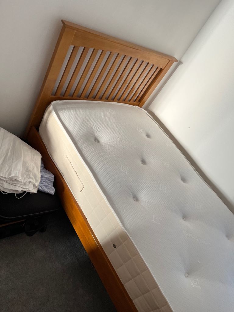Single wooden bed with mattress 