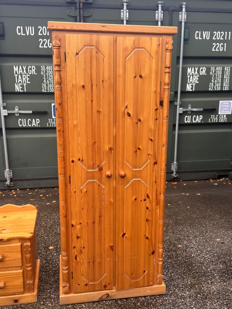 Pine wardrobe with hanging rail and shelf above it