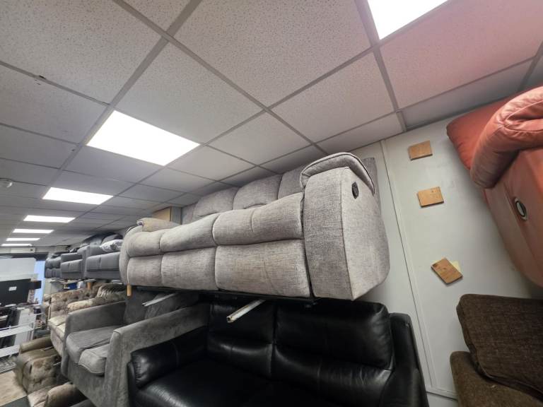 3 seater sofa   Grey fabric  electric reclining   Couple of wee marks not noticable Only £125