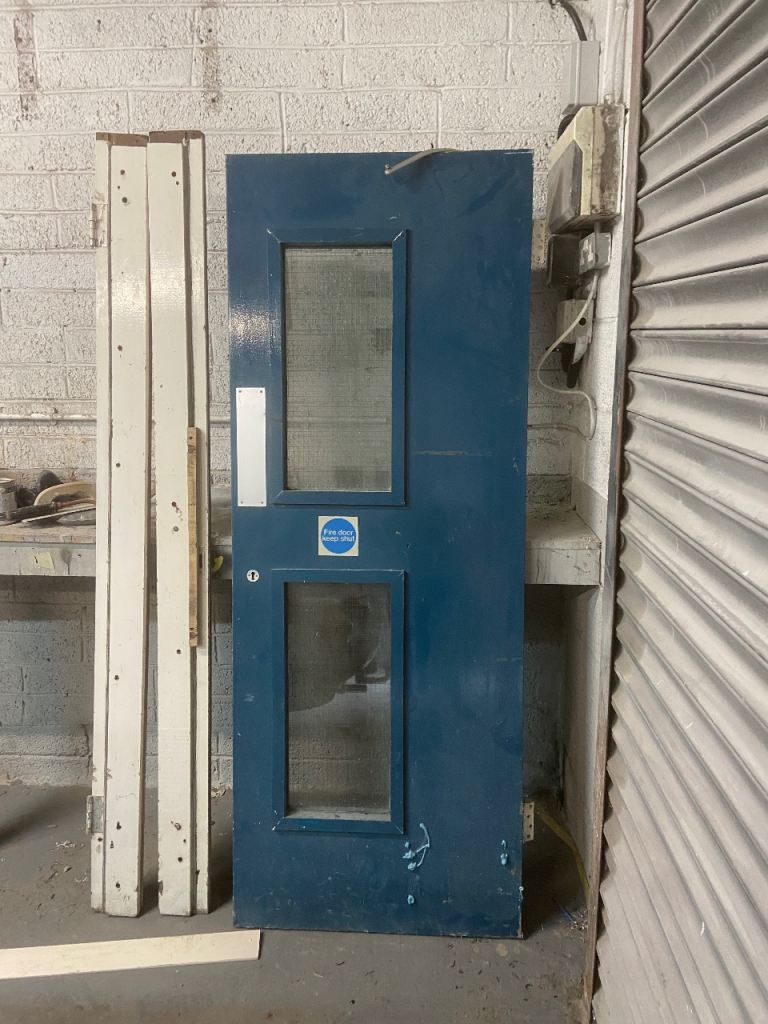 Blue Fire Door with Windows and Frame