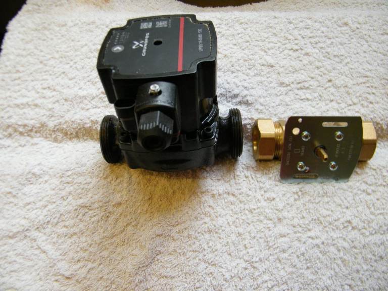 CIRCULATING PUMP AND TWO PORT ZONE VALVE.