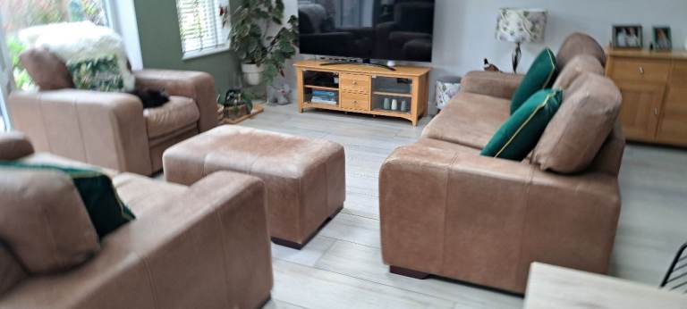 Large Leather three piece suite and footstall