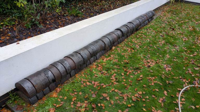 Reclaimed blue half-round bricks