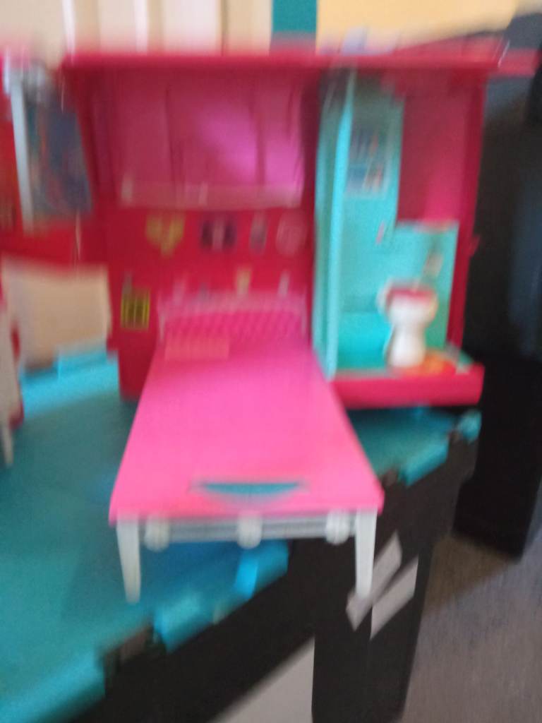 Barbie doll caravan opens up larger 