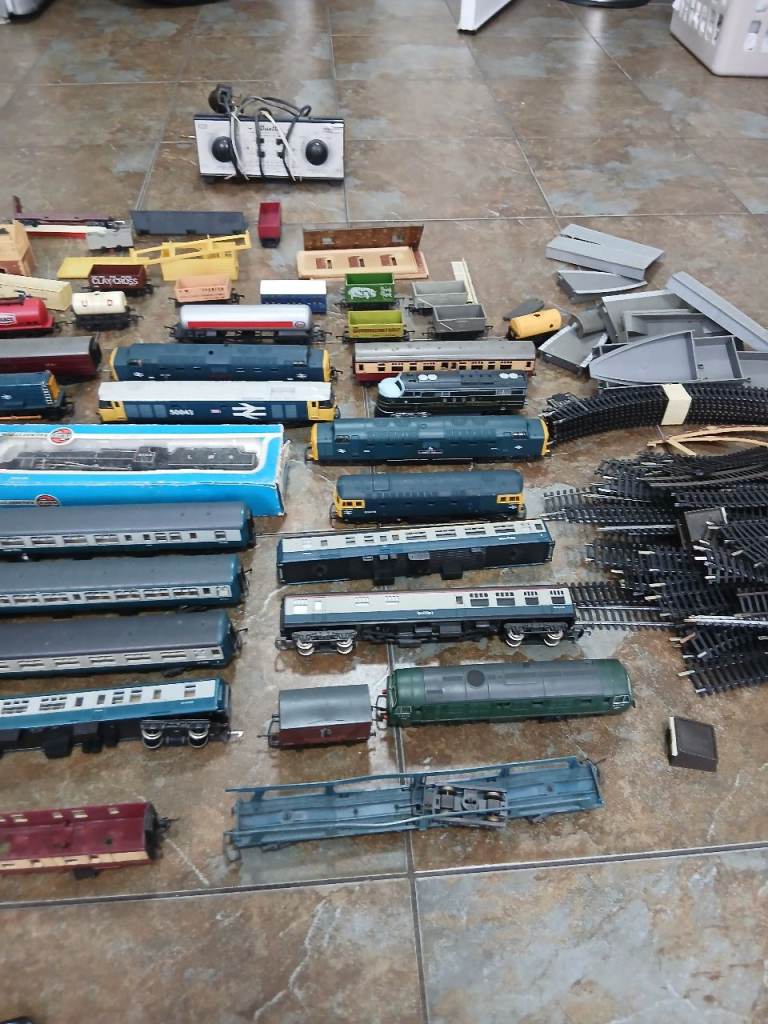 Train set , various train carriages,  loads of track , buildings and other items, some vintage  