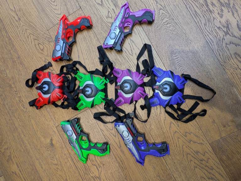 Four laser tag guns and vests